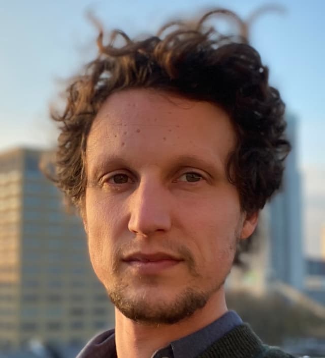 headshot of Ken De Cooman