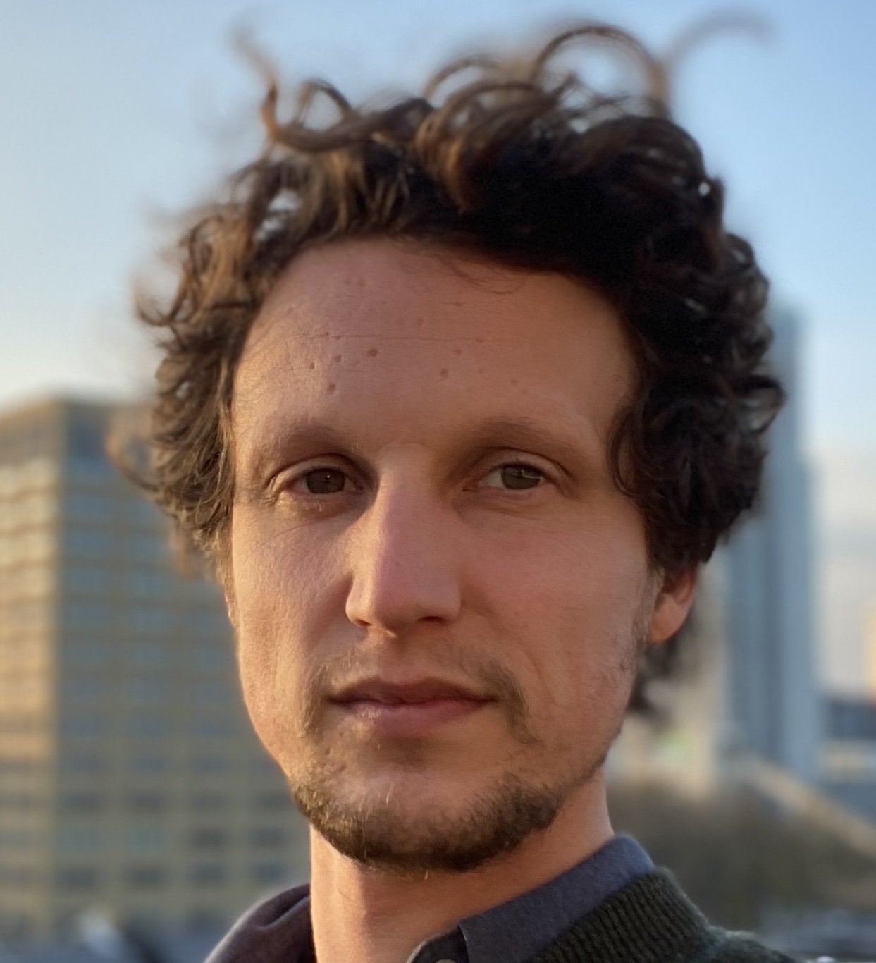 headshot of Ken De Cooman